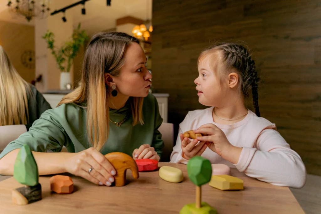 Support worker talking with disabled girl