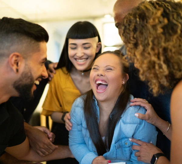 Disabled girl laughing with friends